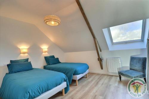 Ein Bett oder Betten in einem Zimmer der Unterkunft L' echappee des fees