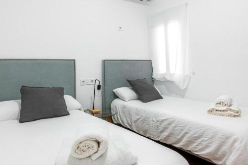 Katil atau katil-katil dalam bilik di Resolana Home Sevilla!