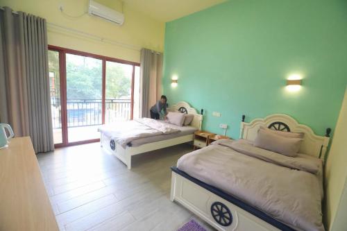 Postel nebo postele na pokoji v ubytování M Y hotel