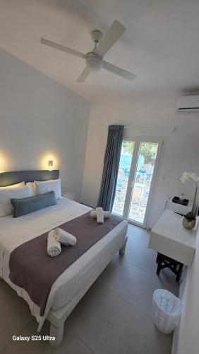 Ένα ή περισσότερα κρεβάτια σε δωμάτιο στο Dinas Inn 