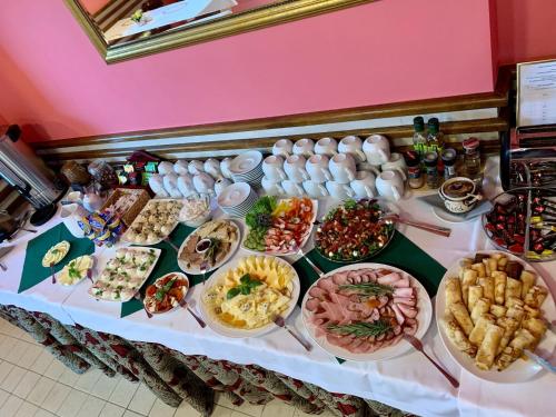 a table with many different types of food on it at Jasny Dwór in Polanica-Zdrój