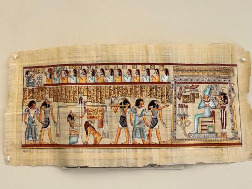 a picture of a painting of people in anubis at Habob Nubian Guest House in Aswan
