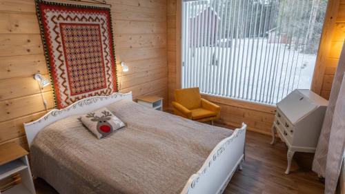 Postel nebo postele na pokoji v ubytování Villa Lehtoniemi with pick-up service by Rovaniemi Insider