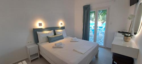 Ένα ή περισσότερα κρεβάτια σε δωμάτιο στο Dinas Inn 
