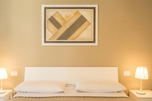 Ένα ή περισσότερα κρεβάτια σε δωμάτιο στο Regis Condo