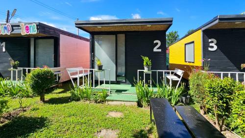 a group of houses with numbers on them at Norn nee Na Hostel นอน นี่ นะ โฮสเทล in Ban Non Na Yao