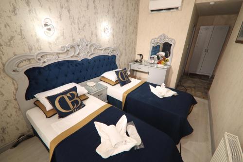 Postel nebo postele na pokoji v ubytování BALPETEK HOTEL
