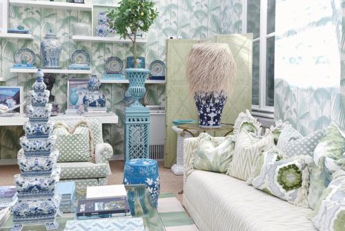 a room with blue and white vases and a couch at Hotel Van Cleef in Bruges
