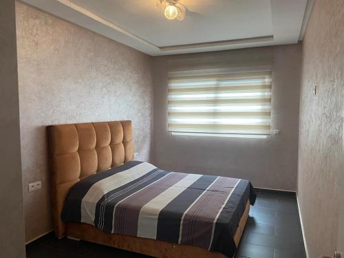 Postel nebo postele na pokoji v ubytování Appartement standing Martil