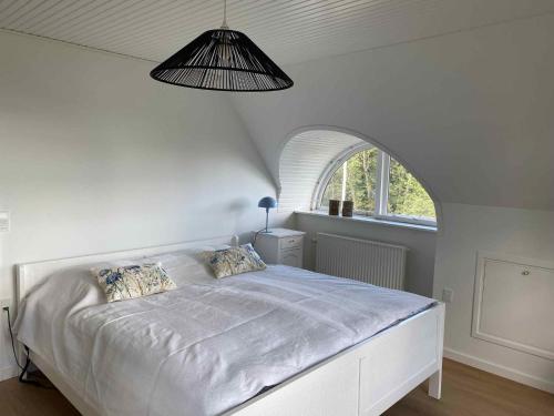 Ένα ή περισσότερα κρεβάτια σε δωμάτιο στο Dream House With View Of The Little Belt