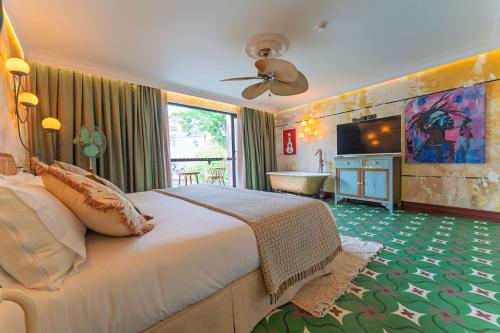 Glam Taoo Hotel Apartamento Boutiqueにあるベッド