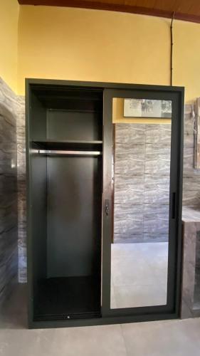 a black door in a room with a window at Villa Barco Private Pool penglipuran 30 in Bangli