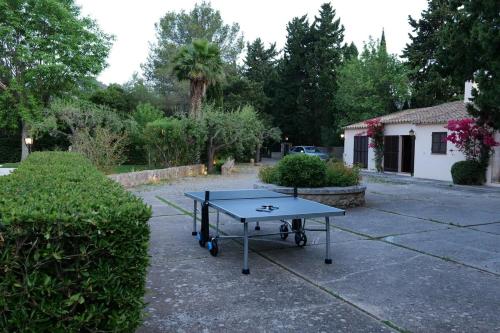 a ping pong table in a parking lot at Can Curt Villa in Pollença