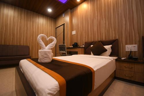 Postel nebo postele na pokoji v ubytování Hotel Adhunik