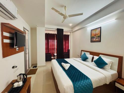 Ένα ή περισσότερα κρεβάτια σε δωμάτιο στο Hotel Elite Inn