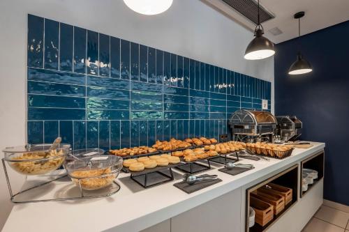 a kitchen with a counter with some food on it at Travelodge Alicante Puerto in Alicante