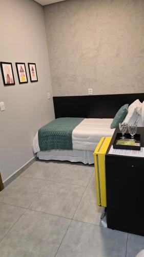 Postel nebo postele na pokoji v ubytování Hotel Flores de Holambra