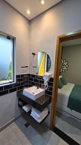 Postel nebo postele na pokoji v ubytování Hotel Flores de Holambra