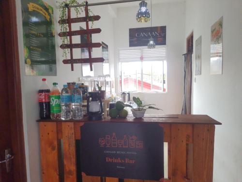 a bar in a kitchen with a sign on it at CANAAN MUSIC Hotel in Moratuwa