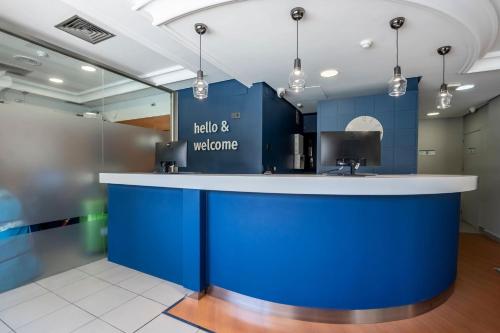 a blue and white counter in a room at Travelodge Alicante Puerto in Alicante