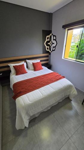 Postel nebo postele na pokoji v ubytování Hotel Flores de Holambra