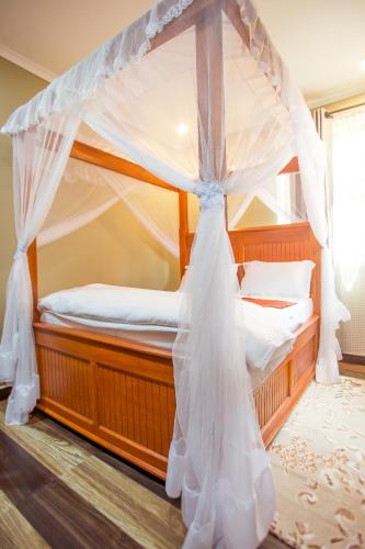 a bedroom with two bunk beds with mosquito netting at Sarnah Apartments in Arusha