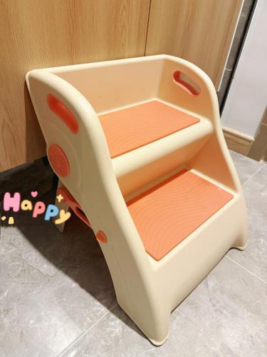 a childrens toy chair with three shelves at Tung Blossom House in Kunming