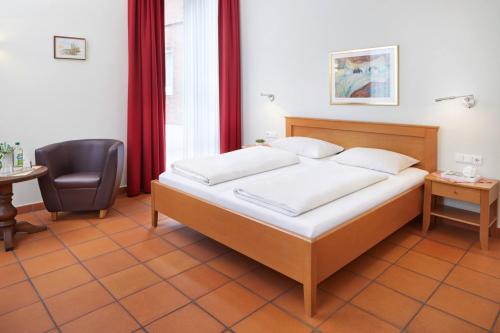 Postel nebo postele na pokoji v ubytování Hotel Hoeker Hof