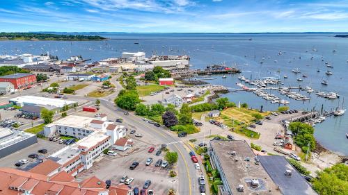 an aerial view of a harbor with boats in the water at Harborline Hotel in Rockland