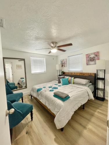 a bedroom with a bed and a ceiling fan at Pool Beach House in New Port Richey
