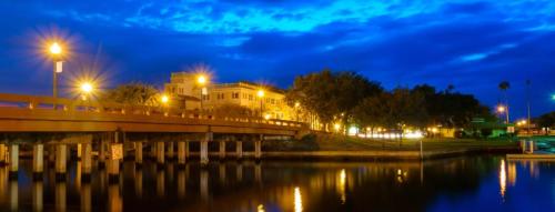 a bridge over a body of water at night at Pool Beach House in New Port Richey