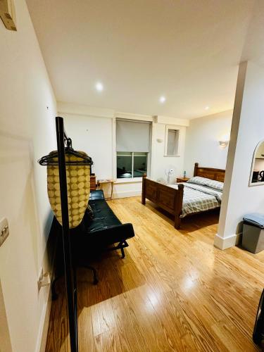 a bedroom with a bed and a lamp in a room at Aspect apartments in Chesham