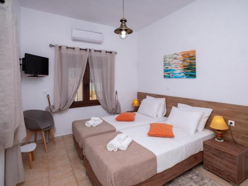 Katil atau katil-katil dalam bilik di Atalanti Seaside Junior Suites, Beachfront