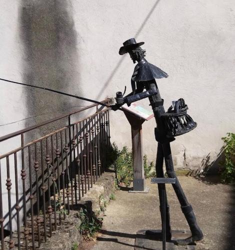 a statue of a man standing on a rail at Le Clos du Vialle in Grillon