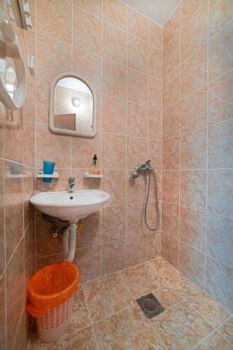 a bathroom with a sink and a shower at Apartment Dragicevic 3 with Garage in Budva