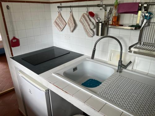 a kitchen with a sink in a kitchen at Villetta Gabriella in Impruneta