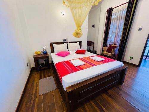 Katil atau katil-katil dalam bilik di Ceylonima Home Stay