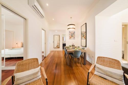 a dining room with a table and chairs and a bedroom at Chiado Gem Private Pool & Patio Retreat in Lisbon