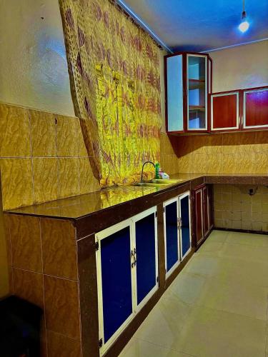 a kitchen with a sink and a counter top at Isamilo House in Mwanza