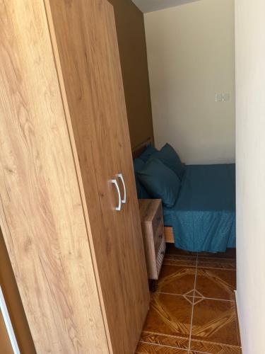 a door in a room with a bed at Stellas superior home in Paphos City