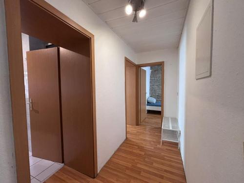 an empty hallway with an open door in a room at Apartment with 3 separate rooms near Leuna in Zeitz