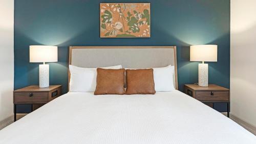 a bedroom with a large bed with two night stands at Landing at Cove at Pine Ridge - 1 Bedroom in Lyman in Lyman
