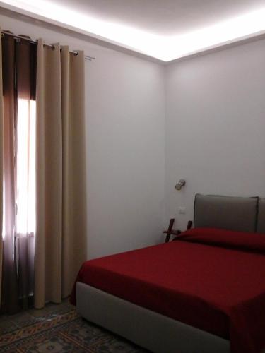 Postel nebo postele na pokoji v ubytování SAT Appartamenti Locazioni turistiche brevi-G&P HOLIDAY HOME