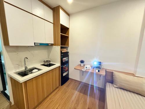 a small kitchen with a sink and a counter at Era Apartment Tam Da in Hanoi