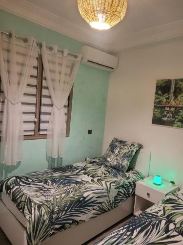 Una cama o camas en una habitación de au cœur de L'orient Marrakech