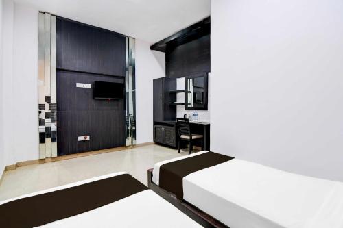 Postel nebo postele na pokoji v ubytování Hotel O Minto Park