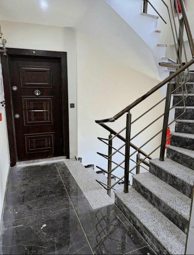 a stairway with a wooden door and a stair case at Link Taksim Hotel in Istanbul