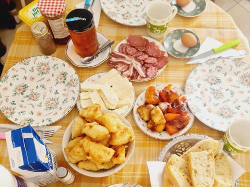 a table with plates of food on it at Seoski dom 