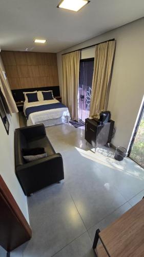 Postel nebo postele na pokoji v ubytování Hotel Flores de Holambra