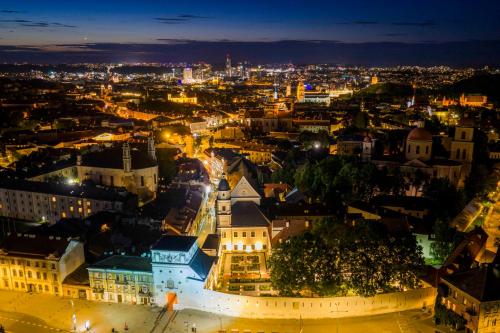 an aerial view of a city at night at Domus Maria in Vilnius